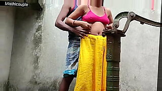 indian mom bathing front her son