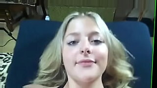 playful blonde with a sexy body strips and fingers herself