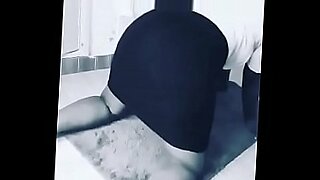 a big ass blonde with tattoos on her back is getting fucked on bed