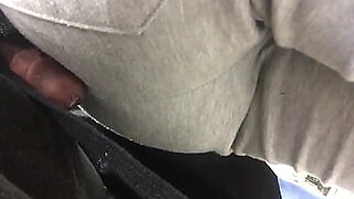 man rubbing cock between legs in train cum